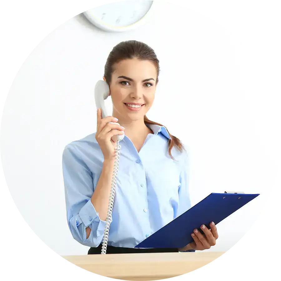 Smiling young woman on the phone with a clipboard in her hand.